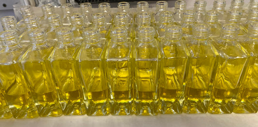 1 ounce bottles of fragrance that have just been filled; a behind the scenes look at Callio Fragrance.